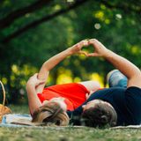 front-view-couple-making-heart-shape-air_23-2148222869